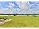 Spacious backyard showcasing a pergola, fire pit, and lake views at 5758 N 900 W, Thorntown, IN 46071