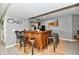Basement bar with wooden bar and barstools, open to game room at 5758 N 900 W, Thorntown, IN 46071