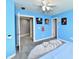 Light blue bedroom with ceiling fan, carpeted floor, and sports memorabilia at 5758 N 900 W, Thorntown, IN 46071