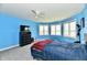Spacious bedroom with ceiling fan, television, dresser, and multiple windows at 5758 N 900 W, Thorntown, IN 46071