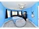 Bright bedroom with accent wall, a large window, ceiling fan, and bean bag chair at 5758 N 900 W, Thorntown, IN 46071