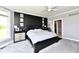 This primary bedroom boasts a decorative black accent wall and lots of natural light at 5758 N 900 W, Thorntown, IN 46071