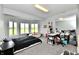 Inviting bedroom offering scenic views through bay windows, plush carpeting, and versatile space for relaxation and creativity at 5758 N 900 W, Thorntown, IN 46071