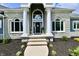 Elegant home entrance with stone accents and meticulously maintained landscaping at 5758 N 900 W, Thorntown, IN 46071
