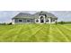 Charming home featuring stone accents, large windows, and a well-manicured lawn at 5758 N 900 W, Thorntown, IN 46071