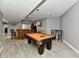 Spacious game room with a billiard table, bar, and laminate flooring at 5758 N 900 W, Thorntown, IN 46071