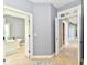 Hallway view leads to the bathroom with soaking tub and the hallway with a view to a bedroom at 5758 N 900 W, Thorntown, IN 46071
