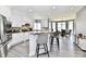 Bright, modern kitchen with a breakfast bar, stainless steel appliances, and views of the dining area at 5758 N 900 W, Thorntown, IN 46071