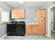 The laundry room has a sink, storage, and modern washer and dryer machines at 5758 N 900 W, Thorntown, IN 46071