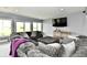 Cozy living room with large sofa and view to backyard through sliding glass doors at 5758 N 900 W, Thorntown, IN 46071