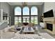 Bright living room with fireplace, plush sectional, and scenic lake views at 5758 N 900 W, Thorntown, IN 46071