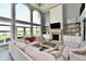 Bright living room boasts a fireplace, built-in shelving, and large windows with scenic outdoor views at 5758 N 900 W, Thorntown, IN 46071
