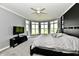 The main bedroom features large windows, lake views, and a decorative ceiling fan at 5758 N 900 W, Thorntown, IN 46071