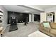 Stylish recreation room boasting exercise equipment, a sleek black accent wall, and plush carpeting for comfort at 5758 N 900 W, Thorntown, IN 46071