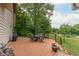Spacious back deck with outdoor seating, BBQ, lush lawn, and a peaceful lake view at 5821 Bittersweet Rd, Morgantown, IN 46160