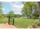 Inviting backyard showcasing a well-maintained lawn and stunning lake views from the deck at 5821 Bittersweet Rd, Morgantown, IN 46160