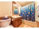 Cozy bathroom featuring a shower with a vibrant fish-themed shower curtain at 5821 Bittersweet Rd, Morgantown, IN 46160