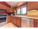 Functional kitchen features updated appliances, ample counter space, and natural light at 5821 Bittersweet Rd, Morgantown, IN 46160