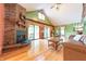 Spacious living room features a cozy fireplace, hardwood floors, and sliding doors to the outdoors at 5821 Bittersweet Rd, Morgantown, IN 46160
