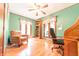 Inviting home office with hardwood floors, natural light, and comfortable seating at 5821 Bittersweet Rd, Morgantown, IN 46160