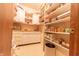 Walk-in pantry with custom shelving and cabinetry for plenty of storage at 5821 Bittersweet Rd, Morgantown, IN 46160