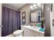 Well-maintained bathroom with shower, vanity, sink, and decorative mirror at 608 Cielo Vista Dr, Greenwood, IN 46143