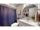 Well-lit bathroom showcasing a modern vanity, round mirror, and a framed motivational art print at 608 Cielo Vista Dr, Greenwood, IN 46143