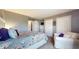 Bright bedroom featuring a queen-sized bed, comfortable couch, and ample closet space at 608 Cielo Vista Dr, Greenwood, IN 46143