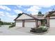 Two-story townhome featuring a two car garage and well-maintained landscaping at 608 Cielo Vista Dr, Greenwood, IN 46143