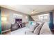 Bright living room featuring a large sectional couch, entertainment center and large window at 608 Cielo Vista Dr, Greenwood, IN 46143
