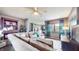 Comfortable living room with sectional couch, lots of pillows, and a decorative rug at 608 Cielo Vista Dr, Greenwood, IN 46143