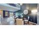 Open-concept living room featuring high ceilings, hardwood floors, a cozy daybed, and a decorative mirror at 608 Cielo Vista Dr, Greenwood, IN 46143