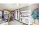 Bright living area featuring stylish decor, a decorative console, and wood-look floors at 608 Cielo Vista Dr, Greenwood, IN 46143
