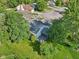 Aerial shot of backyard featuring mature trees and covered deck, offering a private outdoor living space at 7061 Woodgate Cir, Fishers, IN 46038