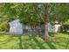 This home's backyard includes a cozy screened in porch and patio for outdoor enjoyment at 7061 Woodgate Cir, Fishers, IN 46038
