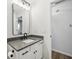 Well lit bathroom with modern fixtures, framed mirror and white vanity at 7061 Woodgate Cir, Fishers, IN 46038