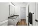 Bathroom features new vanity, sleek black fixtures and hardware and updated flooring at 7061 Woodgate Cir, Fishers, IN 46038