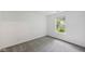 Bright bedroom with a window providing natural light and neutral carpet at 7061 Woodgate Cir, Fishers, IN 46038