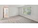 Bedroom featuring neutral carpet, large window and natural light at 7061 Woodgate Cir, Fishers, IN 46038