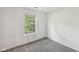 Bright bedroom with neutral carpet, large window and natural light at 7061 Woodgate Cir, Fishers, IN 46038