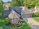 Well-maintained home featuring a lush front lawn and beautiful landscaping, including fresh mulch and decorative plants at 7061 Woodgate Cir, Fishers, IN 46038