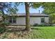 This home has classic siding, updated windows, and mature trees, providing shade and character at 7061 Woodgate Cir, Fishers, IN 46038