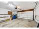 Open garage space with a concrete floor and white garage door at 7061 Woodgate Cir, Fishers, IN 46038