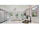 Bright and updated kitchen area with sleek stainless steel appliances and large windows with natural light at 7061 Woodgate Cir, Fishers, IN 46038