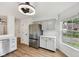 Kitchen features stainless steel refrigerator, stylish cabinetry, and modern lighting at 7061 Woodgate Cir, Fishers, IN 46038