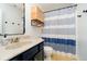 This bathroom features navy accents, a striped shower curtain, and a vanity at 73 Spring Lake Dr, Westfield, IN 46074