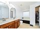 Bathroom suite with a double sink vanity, a bathtub, and a separate walk-in closet area at 73 Spring Lake Dr, Westfield, IN 46074