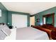 This bedroom includes an en suite bathroom, a large closet and wood furniture at 73 Spring Lake Dr, Westfield, IN 46074