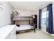 This bedroom includes a gray bunkbed, decor, and a natural light window at 73 Spring Lake Dr, Westfield, IN 46074