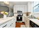 Bright kitchen with white cabinetry, modern appliances, and stylish finishes at 73 Spring Lake Dr, Westfield, IN 46074